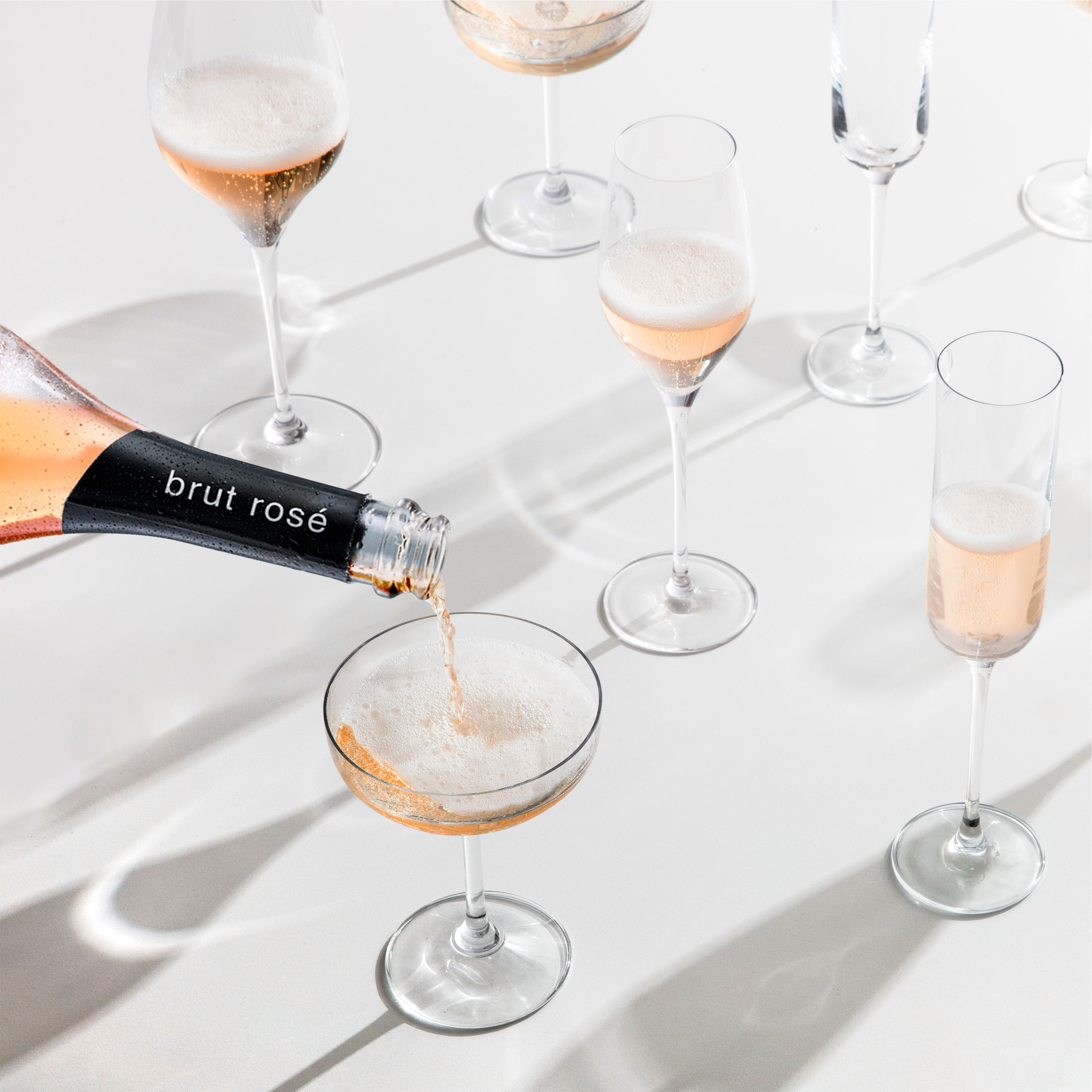 pouring sparkling rose wine